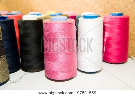 Many Reels Of  Threads Standing On The Table