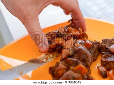 Dish Of Pork With Sauce On The Yelloow Plate