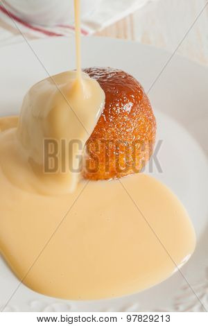 Steamed golden syrup sponge pudding and vanilla custard
