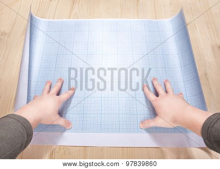 Hands Holding A Blank Of The Blueprint