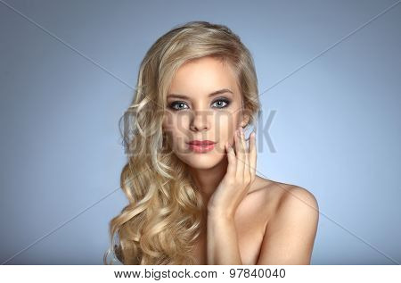 Portrait Of Beautiful Woman On Blue Background