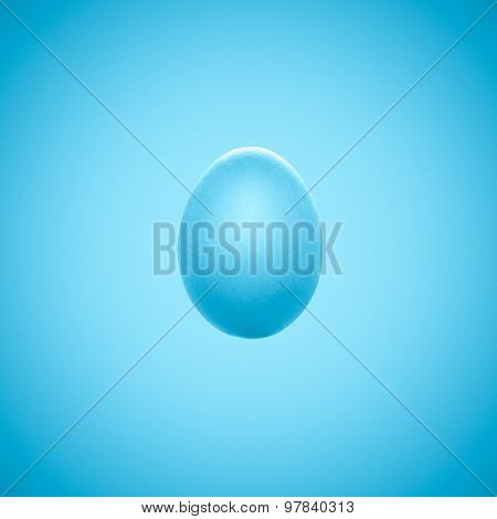 Bright Blue Easter Egg Isolated On Blue Background