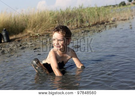 Boy Applying Healthy Mud