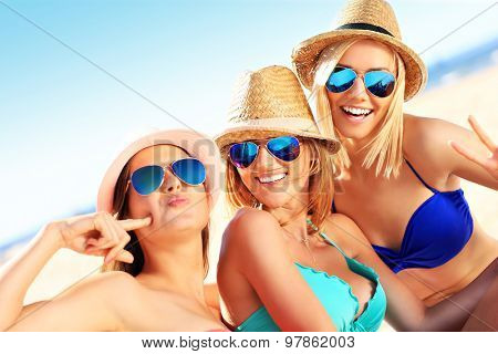 A picture of a group of women having fun on the beach