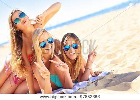 A picture of a group of women having fun on the beach