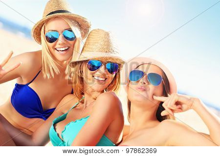 A picture of a group of women having fun on the beach