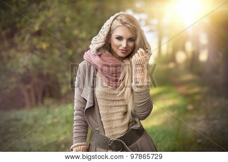 Young Girl Smiling In Autumn Scenery