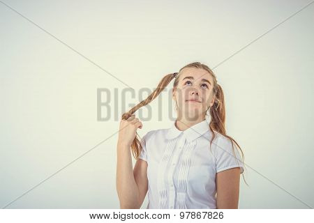 Schoolgirl thinking isolated on white background