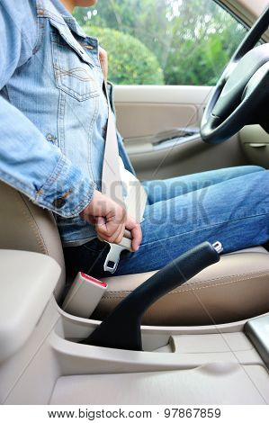 closeup of woman driver buckle up seatbelt