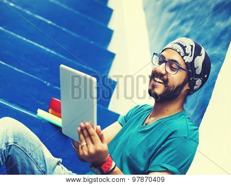 Sikh Guy Browsing Tablet Stair Case Concept
