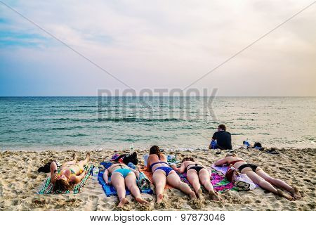 KOH CHANG, THAILAND- APRIL 15, 2015: Tourists sunbathing on sand of Lonely beach at Koh Chang island. Lonely beach - the main holiday destination backpackers at Koh Chang.
