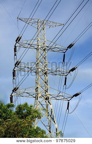 Steel Pylons And High Voltage Transmission Lines Flowing Stream.