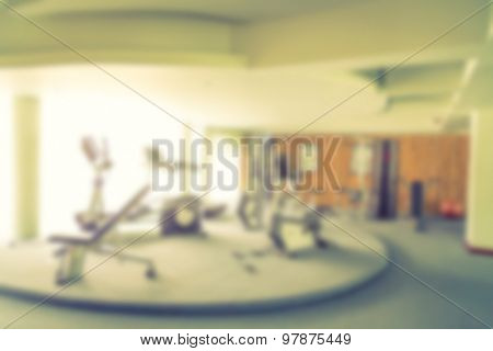 Abstract blur Fitness center with traineger equipments  ( Filtered image processed vintage effect. )