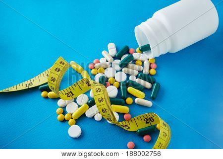 Measuring Tape And Pills For Dieting Concept. Electrocardiogram With Pills And Tablets Above, Ekg Me