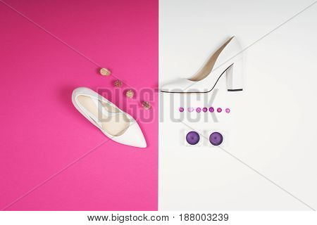 Shoes fashion. Stylish Trendy white heels on a pink background. Summer fashion Outfit, Luxury Party shoes. Minimal fashion concept.