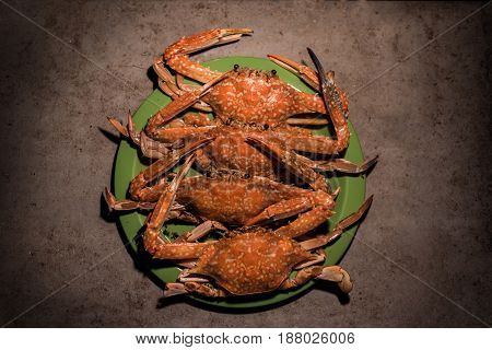 Close up Grilled flower crabs at campfire.