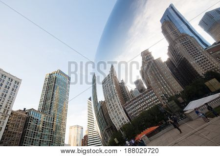 Chicago, USA - October 17 2016: Cloud gate, otherwise nown as 'The Bean' in Millenium Park at dusk on a hot summer's afternoon