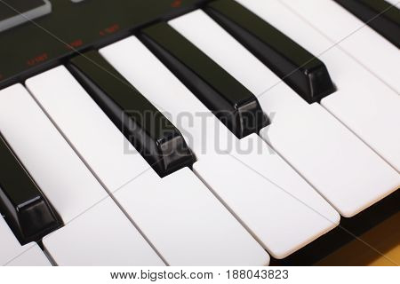 Musical instrument - Sloseup MIDI piano black and white keyboard.