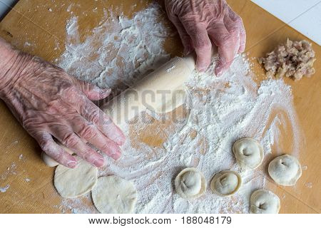 Sculpting Of Traditional Russian Meat Dumplings With Minced Meat