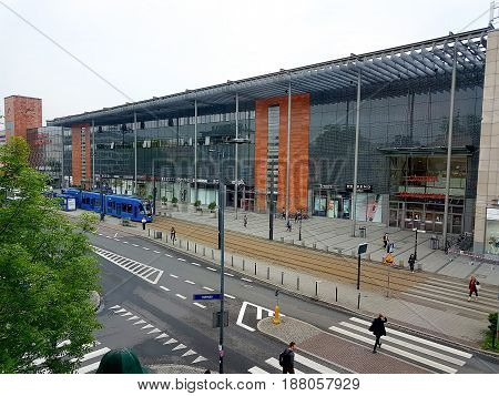 Krakow, Poland - May 24 2017: Krakow Public Transportation modern blue tram.
Day View of Krakowiak low-floor tram of Krakow tramway network running by the facade of Galeria Krakowska shopping Mall.