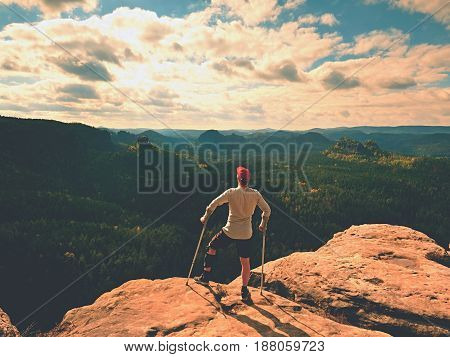 Happy Man With Broken Leg In Immobilizer And Medicine Pole Stay Finnaly On  Peak.