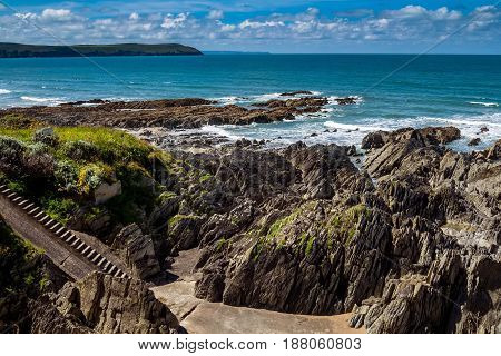 Rocky beach near the beach of Woolacombe. Sunny day. Summer. North Devon. England.