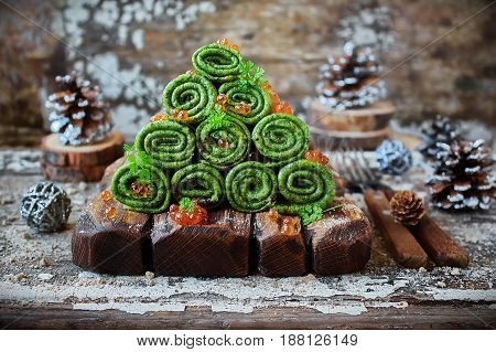 green pancakes with spinach, caviar and watercress