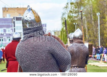 Moscow - May13 2017. Reconstruction of medieval battle between russian and european warriors on school foorball field
