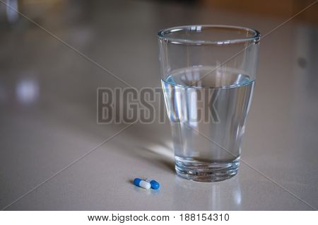 Pills Capsules Medicine And Glass Of Water