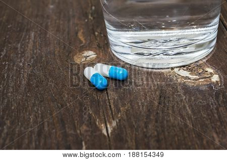 Pills Capsules Medicine And Glass Of Water