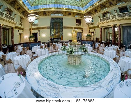 MOSCOW RUSSIA - APRIL 27 2017: Marble fountain of Metropol hotel main restaurant in Moscow Russia on April 27 2017. Hotel was built in 1899-1907 in Art Nouveau style.