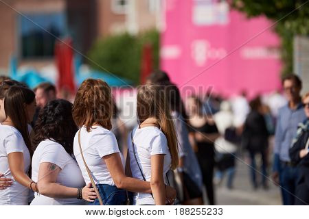 DUESSELDORF, GERMANY - AUGUST 06, 2016: A group of unidentified young ladies line up for photographers during their stag party visit at the Rhine promenade in Duesseldorf.