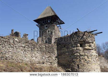 Ruins of Castle Nevytske near of Transcarpathian region center Uzhgorod photo. Nevitsky Castle ruins built in 13th century. Ukraine.