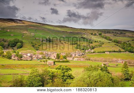 Gunnerside Village in Swaledale - Swaledale in Yorkshire Dales National Park winds into the northern Pennines. It is famous for its meadows field barns and drystone walls.