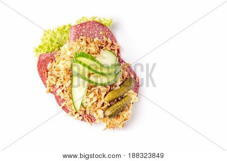 Danish specialties and national dishes high-quality open sandwich Salami with crispy fried onion remoulade and cucumber isolated on white background