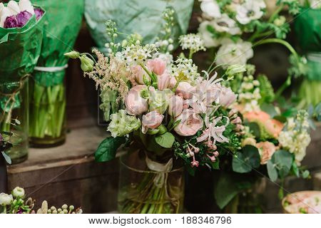 Tenderless bouquet of pink and white roses. petals and other flovers in vase