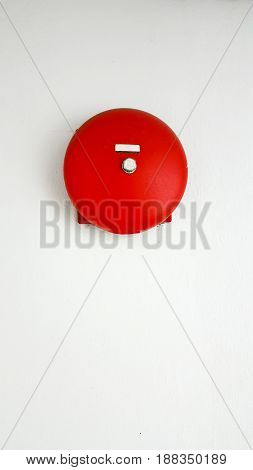 Fire alarm on white wall background .