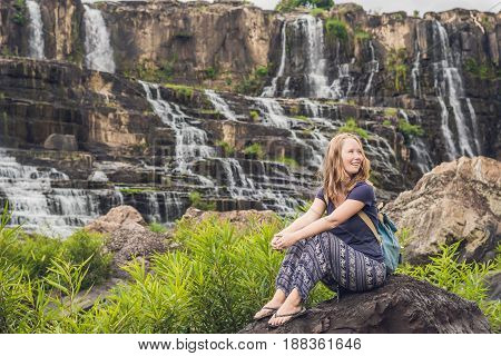 Young Woman Hiker, Tourist On The Background Of Amazing Pongour Waterfall Is Famous And Most Beautif