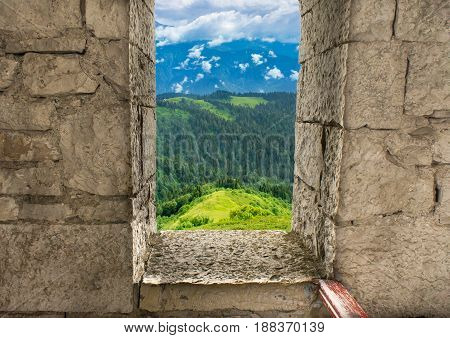 Window in an old fortress overlooking the Caucasus mountains in Sochi in Russia