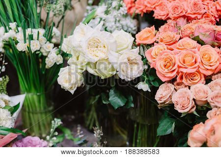 Gorgeous bouquets of pink and white roses and tenderless white peonies