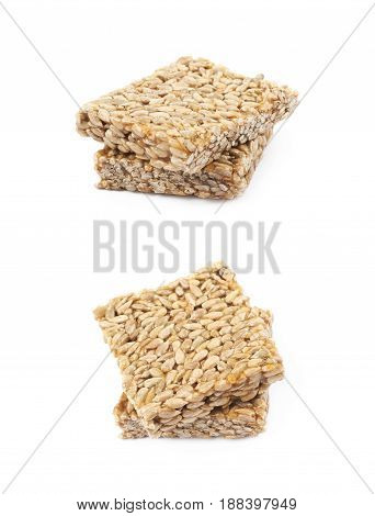 Two pieces of gozinaki confection sweets isolated over the white background, set of two different foreshortenings