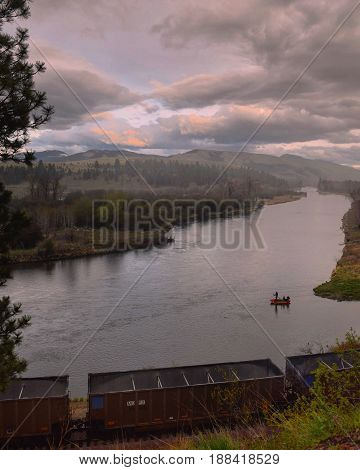 A fishing raft floats down the river