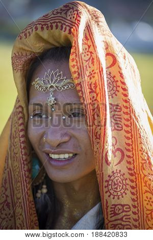 Portrait  Sirena Sabiha dancing at sunrise in Pokhara Nepal. Sirena was born in the Philippines. Close up
