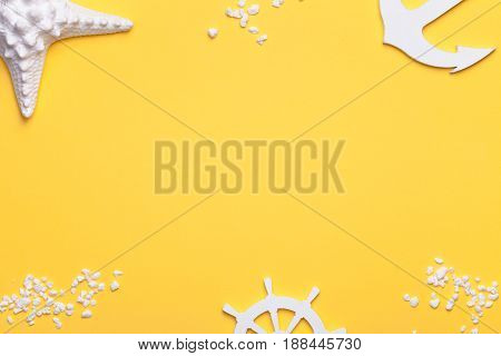 Summer holiday vacation background with starfish anchor and rudder in white. Copy space. Top view