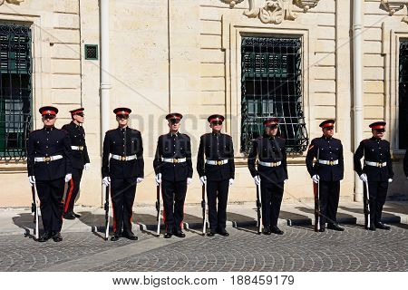 VALLETTA, MALTA - MARCH 30, 2017 - Uniformed soldiers on parade outside the Auberge de Castille for a European Union conference in Castille Square Valletta Malta Europe, March 30, 2017.