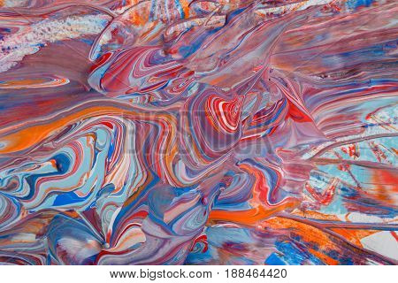 Liquid abstract paint background. Fluid painting texture. Colorful mix of acrylic vibrant colors.