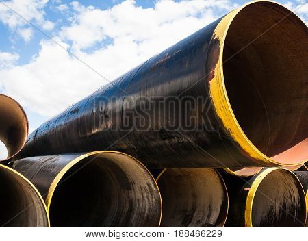 Stack of new metal pipes. Industrial material.