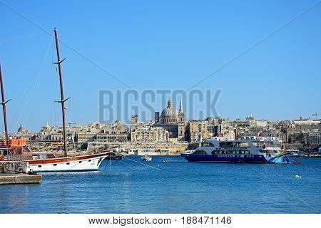 VALLETTA, MALTA - MARCH 30, 2017 - View of St Pauls Anglican Cathedral and the Basilica of Our Lady of Mount Carmel seen from the Grand Harbour Valletta Malta Europe, March 30, 2017.