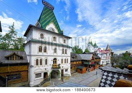 MOSCOW, MAY 26, 2017: Izmailovsky Kremlin inner yard. White stone manor. Russian traditional classic wooden and stone architecture buildings. Classic white stone empirial palace Russian architecture