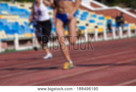 Blurred View Of Athletic Running Competition At Stadium Not In Focus